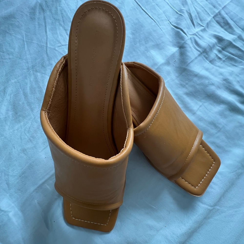 Stylish and New French Connection squared open toe mule heels. Size 11
